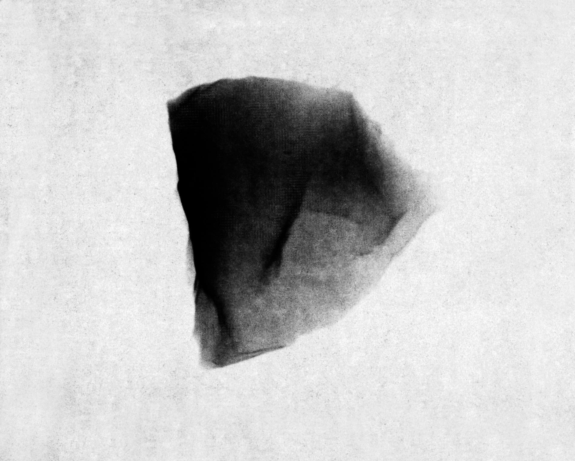W7029E16, 2018. From the series Printed Matter, printed with black carbon pm 2.5 pollution, extracted from the air. Image from a special issue of NASA Cosmic Dust Catalogue, April 1982, p85.